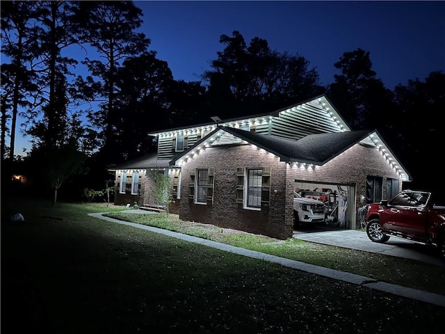 265 Traders Hill Rd, Folkston, GA 31537 - view of side of home with concrete driveway, brick siding, and a garage