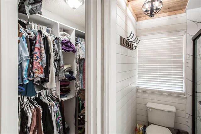 265 Traders Hill Rd, Folkston, GA 31537 - bathroom featuring toilet, a textured ceiling, and a walk in closet