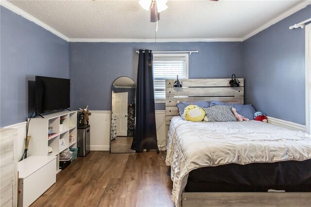 265 Traders Hill Rd, Folkston, GA 31537 - bedroom with ceiling fan, a textured ceiling, wood finished floors, and ornamental molding