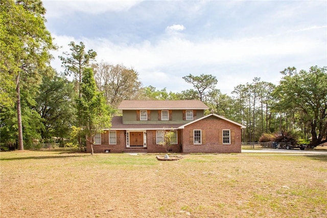 265 Traders Hill Rd, Folkston, GA 31537 - view of front of property with brick siding, a front lawn, and fence
