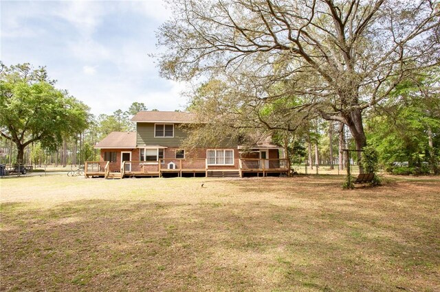 265 Traders Hill Rd, Folkston, GA 31537 - back of house with a deck and a lawn