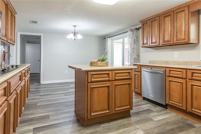 1348 Crestridge Rd, Waycross, GA 31503 - kitchen featuring dishwasher, brown cabinets, a chandelier, and wood finished floors