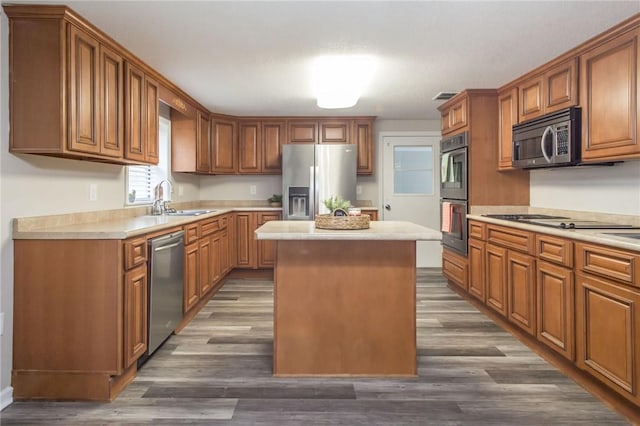 1348 Crestridge Rd, Waycross, GA 31503 - kitchen featuring appliances with stainless steel finishes, light countertops, and a center island