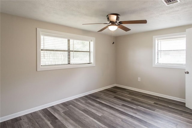 1348 Crestridge Rd, Waycross, GA 31503 - spare room featuring a ceiling fan, dark wood-type flooring, and a textured ceiling