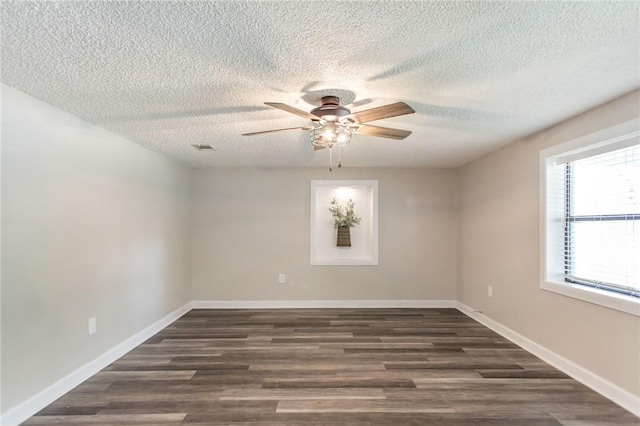 1348 Crestridge Rd, Waycross, GA 31503 - empty room featuring a textured ceiling, dark wood-style flooring, and a ceiling fan