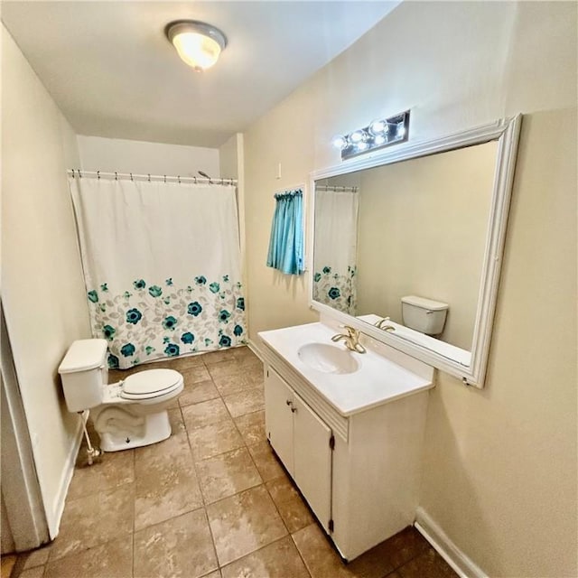 1110 Waller St, Waycross, GA 31501 - bathroom with tile patterned flooring, toilet, vanity, and baseboards