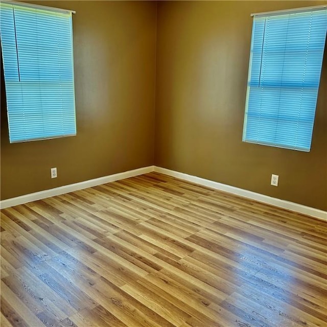 1110 Waller St, Waycross, GA 31501 - unfurnished room with baseboards and wood finished floors