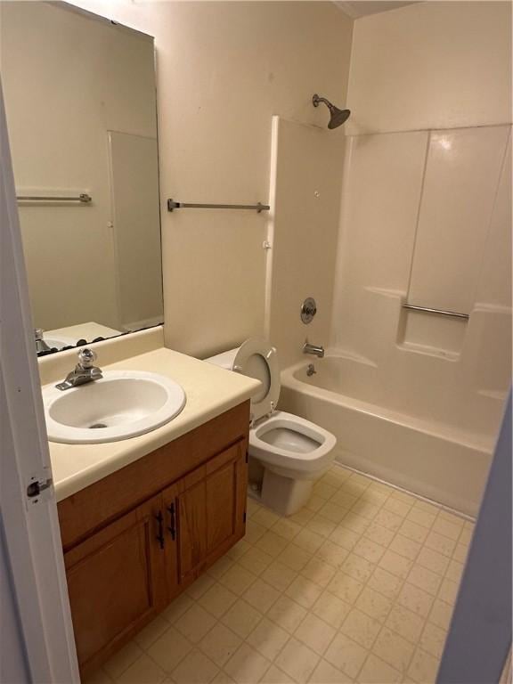 bathroom with toilet, bathing tub / shower combination, and vanity