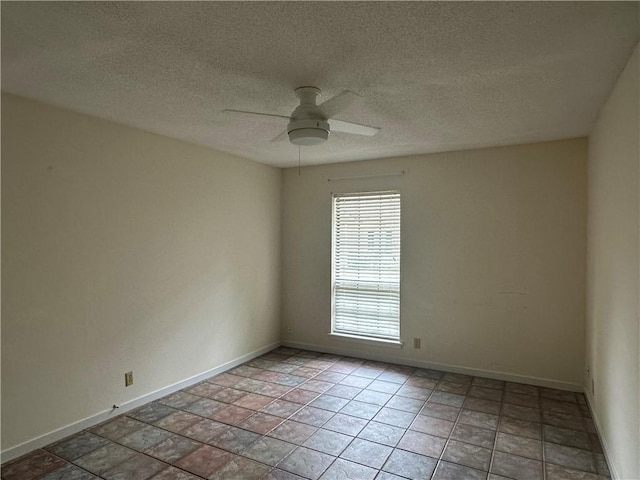 empty room with baseboards, a textured ceiling, and ceiling fan