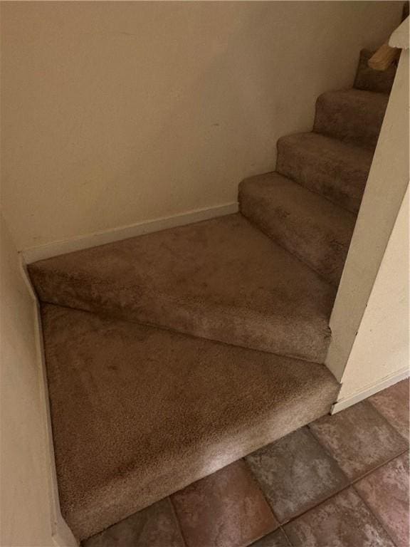 staircase with baseboards