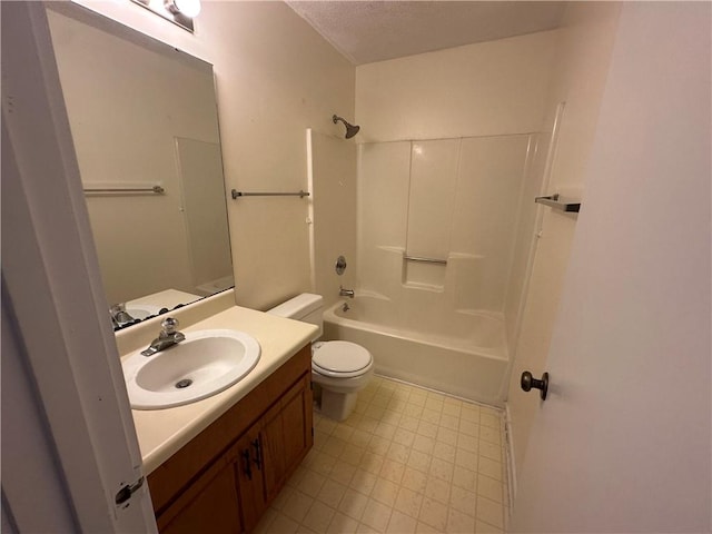 full bathroom with a textured ceiling, vanity, tile patterned floors, toilet, and washtub / shower combination