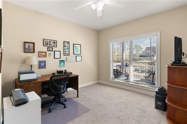 office space with light colored carpet and ceiling fan