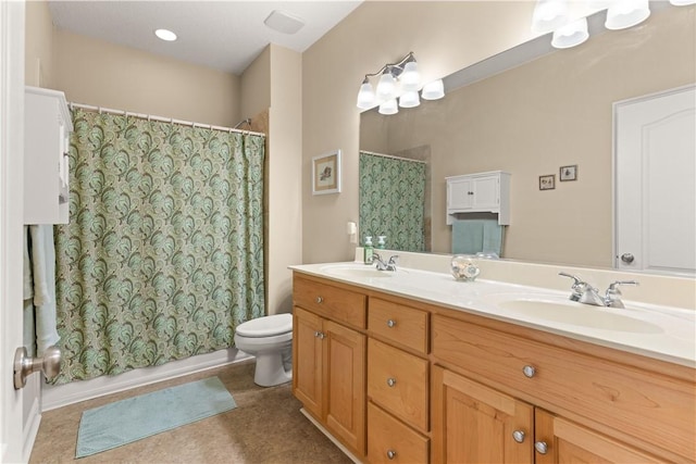 bathroom featuring toilet and vanity