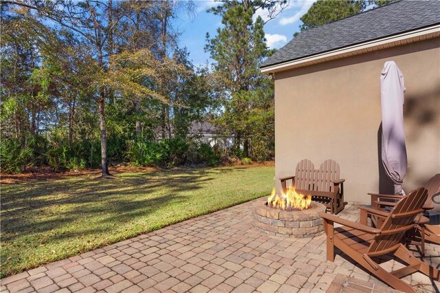 view of patio / terrace with a fire pit