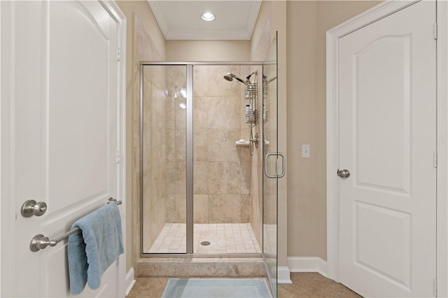 bathroom featuring crown molding, walk in shower, and tile patterned floors