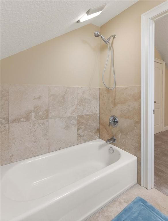 bathroom with shower / washtub combination and tile patterned flooring