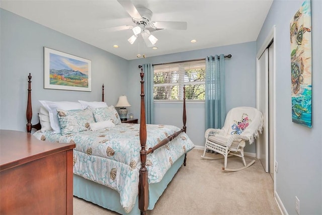 bedroom with baseboards, recessed lighting, light colored carpet, a ceiling fan, and a closet