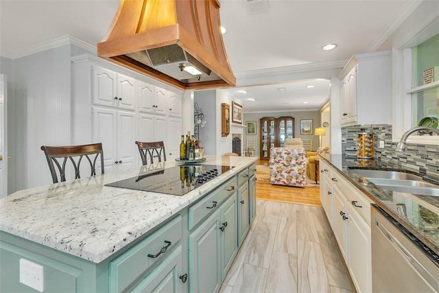 kitchen with white cabinets, black electric cooktop, dishwasher, a sink, and premium range hood