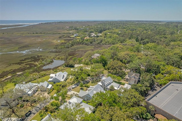 bird's eye view with a forest view, a water view, and a residential view