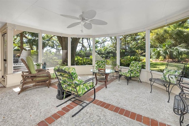 sunroom featuring ceiling fan