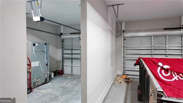 garage featuring baseboards and a garage door opener