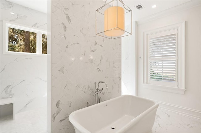 329 Saint Annies Ln, Saint Simons Island, GA 31522 - bathroom with marble tiled flooring, a soaking tub, plenty of natural light, crown molding, and recessed lighting