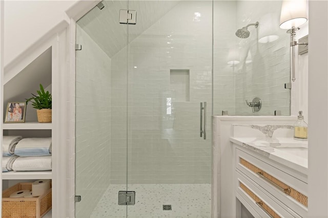 329 Saint Annies Ln, Saint Simons Island, GA 31522 - full bathroom featuring a shower stall, vanity, and vaulted ceiling