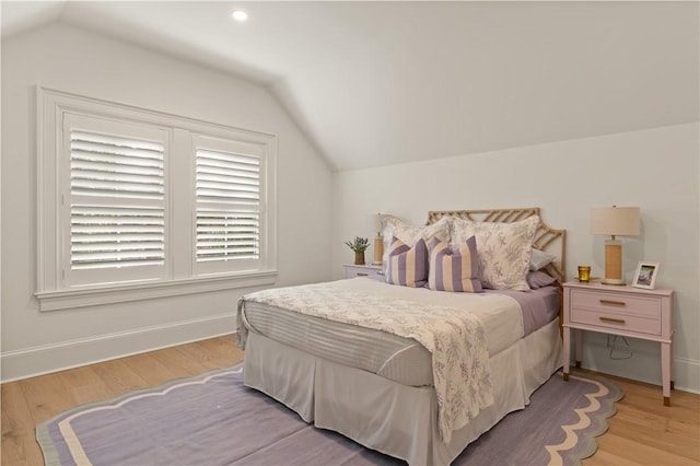 329 Saint Annies Ln, Saint Simons Island, GA 31522 - bedroom with lofted ceiling and wood finished floors