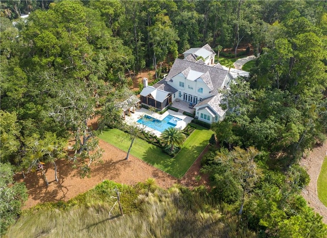 329 Saint Annies Ln, Saint Simons Island, GA 31522 - aerial view of property and surrounding area featuring a pool and a forest