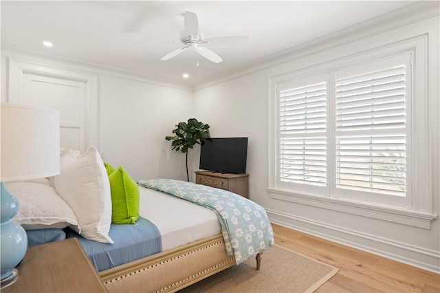 329 Saint Annies Ln, Saint Simons Island, GA 31522 - bedroom with wood finished floors, ornamental molding, a ceiling fan, and recessed lighting