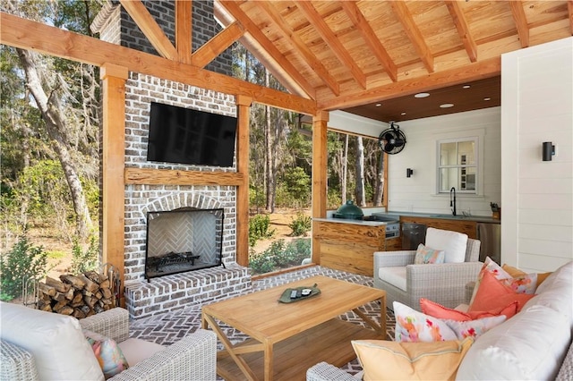 329 Saint Annies Ln, Saint Simons Island, GA 31522 - view of patio / terrace with an outdoor living space with a fireplace and area for grilling