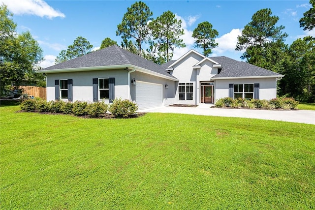 119 Silver Bluff Dr, Brunswick, GA 31523 - view of front of home featuring stucco siding, a garage, and concrete driveway