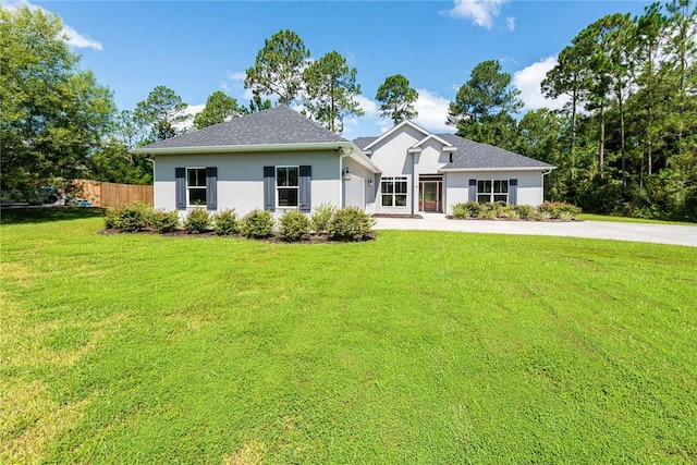 119 Silver Bluff Dr, Brunswick, GA 31523 - view of front facade featuring stucco siding, concrete driveway, and an attached garage