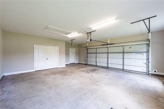 119 Silver Bluff Dr, Brunswick, GA 31523 - garage with baseboards and a garage door opener