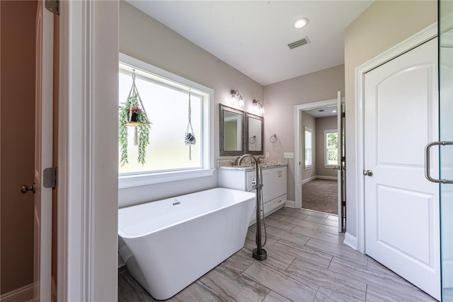 119 Silver Bluff Dr, Brunswick, GA 31523 - full bathroom featuring vanity and a soaking tub