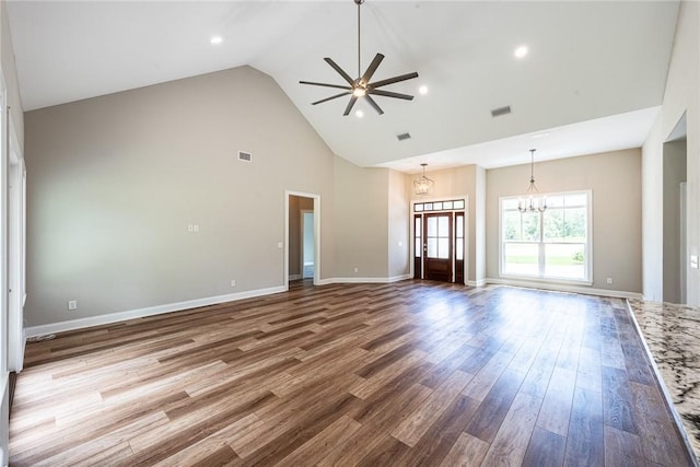 119 Silver Bluff Dr, Brunswick, GA 31523 - unfurnished living room featuring high vaulted ceiling, a chandelier, ceiling fan, wood finished floors, and recessed lighting
