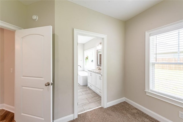119 Silver Bluff Dr, Brunswick, GA 31523 - corridor with plenty of natural light and light carpet