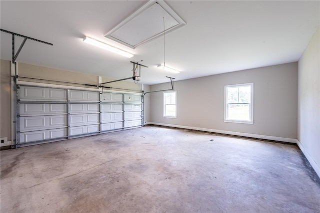 119 Silver Bluff Dr, Brunswick, GA 31523 - garage with baseboards and a garage door opener
