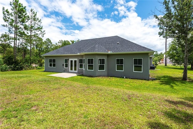 119 Silver Bluff Dr, Brunswick, GA 31523 - rear view of house featuring stucco siding, a patio area, french doors, and a yard