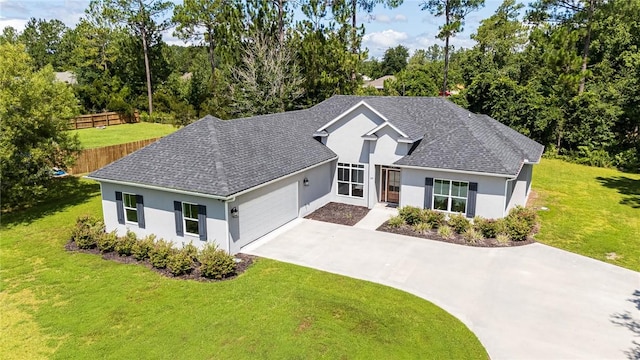 119 Silver Bluff Dr, Brunswick, GA 31523 - view of front of home featuring stucco siding, concrete driveway, an attached garage, and a shingled roof