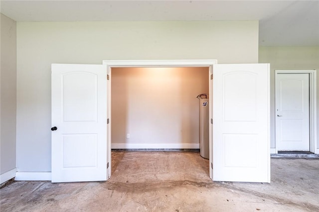 119 Silver Bluff Dr, Brunswick, GA 31523 - unfurnished bedroom with concrete floors and baseboards