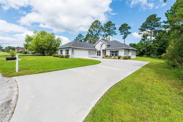 119 Silver Bluff Dr, Brunswick, GA 31523 - single story home with a garage, concrete driveway, a front yard, and stucco siding