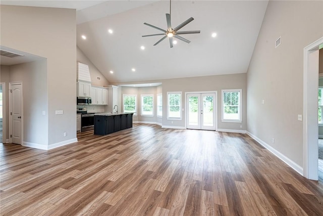 119 Silver Bluff Dr, Brunswick, GA 31523 - unfurnished living room with high vaulted ceiling, ceiling fan, wood finished floors, and recessed lighting