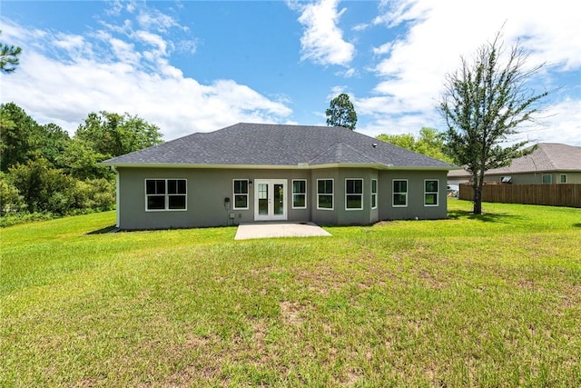 119 Silver Bluff Dr, Brunswick, GA 31523 - back of property with french doors, a patio, and stucco siding