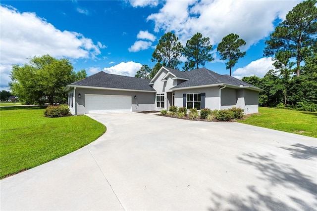 119 Silver Bluff Dr, Brunswick, GA 31523 - ranch-style home featuring stucco siding, an attached garage, a front yard, and concrete driveway