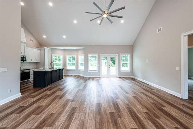 119 Silver Bluff Dr, Brunswick, GA 31523 - unfurnished living room with high vaulted ceiling, ceiling fan, wood finished floors, and recessed lighting