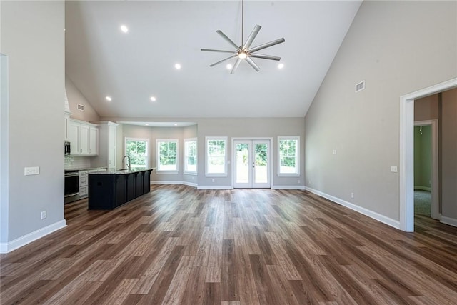119 Silver Bluff Dr, Brunswick, GA 31523 - unfurnished living room with high vaulted ceiling, a ceiling fan, dark wood-style floors, and recessed lighting