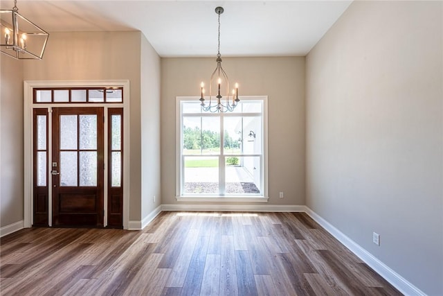 119 Silver Bluff Dr, Brunswick, GA 31523 - entryway featuring a chandelier and dark wood finished floors