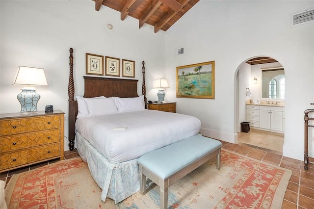 10 Dune Ave Unit 18Int 3, Sea Island, GA 31561 - bedroom with wooden ceiling, high vaulted ceiling, ensuite bath, tile patterned flooring, and beam ceiling