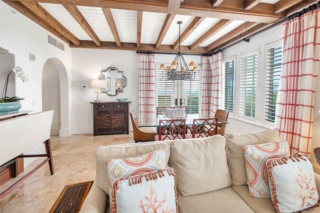 10 Dune Ave Unit 18Int 3, Sea Island, GA 31561 - tiled living room featuring beamed ceiling and an inviting chandelier
